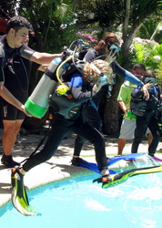 family with kids taking dive course in moalboal